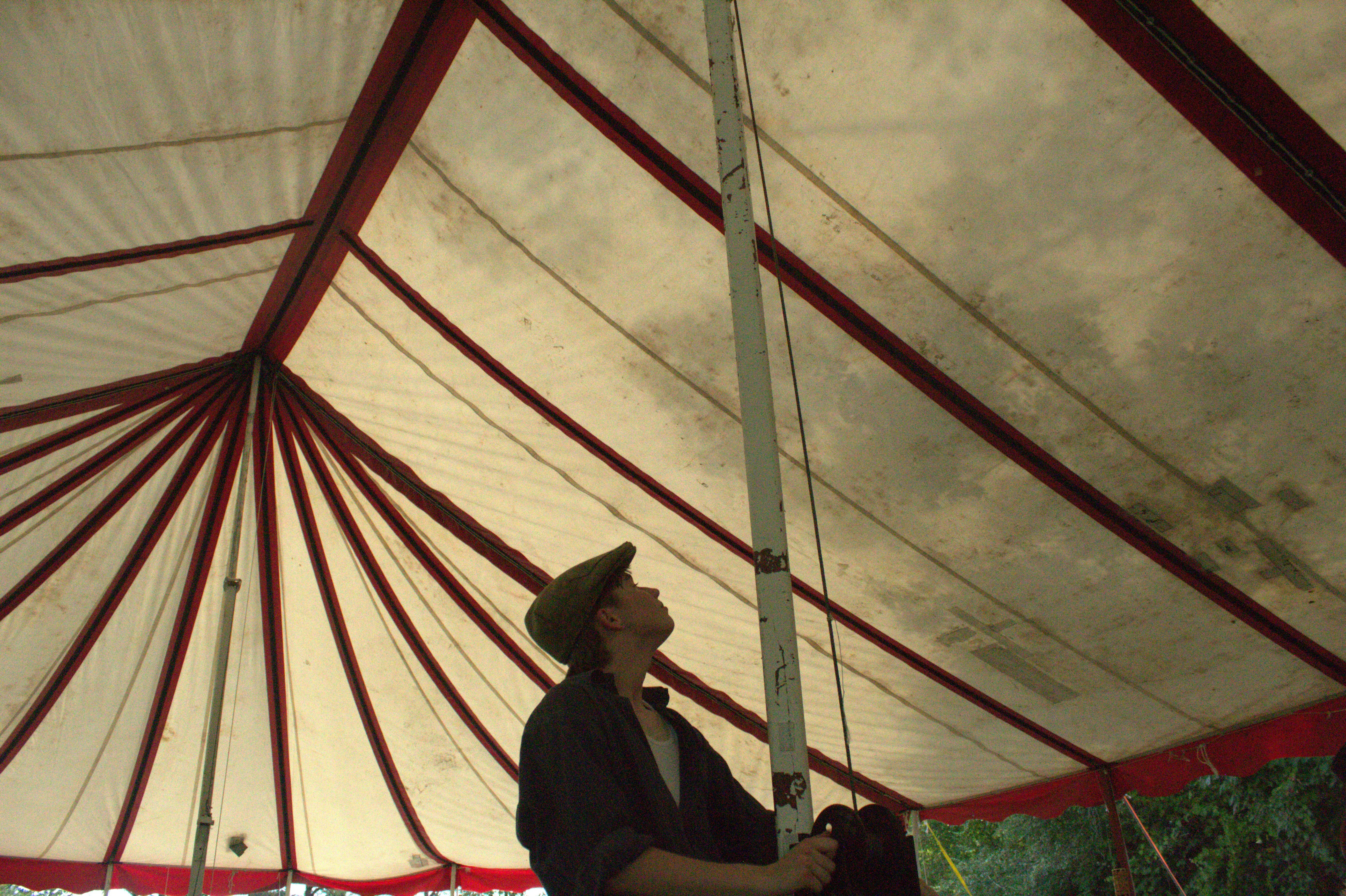 Looking up at the big top's canvas ceiling from inside the tent